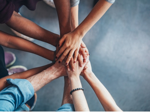 People holding hands in a circle